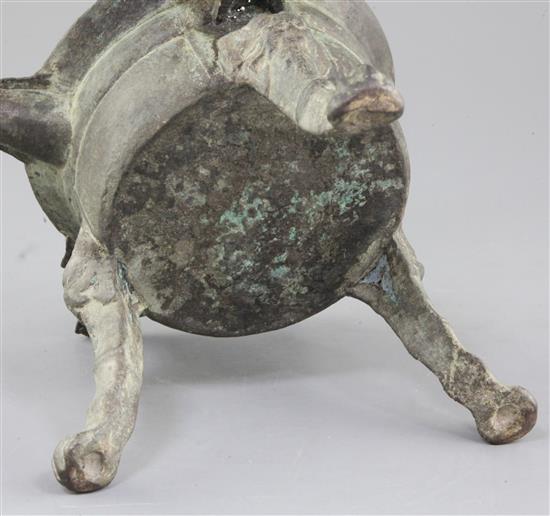 A Chinese archaic bronze tripod ritual wine-warming vessel, Jiao Dou, Southern & Northern dynasties, 6th century A.D., 31cm long, 22cm